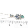 Aqua Sea Glass Open Lotus Necklace on ruler for size reference.