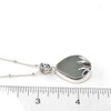 Seafoam Sea Glass Lily Necklace on ruler for size reference.