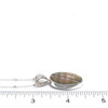Abalone Swirl Bail Necklace on ruler for size reference.
