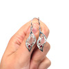Pink Sea Glass and Ruby Wavy Earrings on model for color reference.