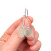 Seafoam Sea Glass and Labradorite Gemstone Drop Earrings on model for color reference.