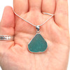 Aqua Sea Glass Pyramid Necklace on palm for color reference