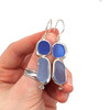 Cobalt and Cornflower Double Sea Glass Swirl Bezel Earrings in hand for color reference