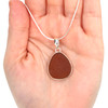 Amber Smooth Drop Sea Glass Single Bezel Necklace on model for color reference.