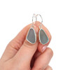 Aqua Ice Elongated Sea Glass Single Bezel Earrings on model for color reference.