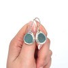 Aqua Sea Glass Double Bezel Earrings on model for color reference. 