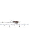 Abalone Shimmer Elongated Charm on ruler for size reference.