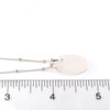 White Oval Sea Glass Pinch Necklace on ruler for size reference. 