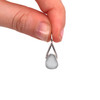 Gray Sea Glass Lunar Drop Charm held to the light