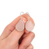 White Snow Sea Glass Bezel Earrings on model for color reference.