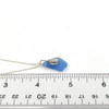 Cornflower Triangle Sand Dollar Charm Necklace on ruler for size reference