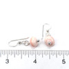 Conch Shell Dainty Drop Earrings on ruler for size reference.