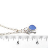 Cornflower Sea Glass and Key Charm Necklace on ruler for size 