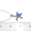 Cornflower Cruise Sea Glass Sea Turtle Necklace on ruler for size reference
