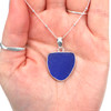 Cobalt Crest Sea Glass Bezel Set Classic Necklace in hand for color reference