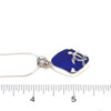 Cobalt Sea Glass Swimming Turtle Necklace on ruler for size reference. 
