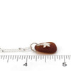Amber Sea Glass and Tiny Starfish Nautical Charm Necklace on ruler for size reference.