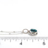 Turquoise Double Bezel Charm on ruler for size reference. 