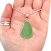 Seafoam Bright Sea Glass Bezel Set Necklace on palm for color reference