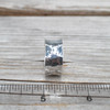 Silver Hammered Wide Band Ring on ruler