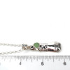 Seafoam UV Milk Glass Lighthouse Necklace on ruler