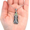 Seafoam UV Milk Glass Lighthouse Necklace on palm
