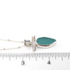 Aqua Oval Sea Glass Toggle Bar Necklace on ruler for size reference. 