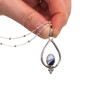 Cobalt Ocean Deep Ultra Rare Sea Glass Trinity Drop Necklace held to the light for color detail
