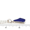 Cobalt Blue Diamond Drop Sea Glass Bezel Necklace on ruler for size reference.
