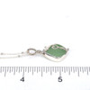 Seafoam Bright Sea Glass Wave Necklace on ruler for size reference. 
