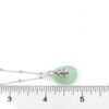 Seafoam Round Sea Glass and Sand Dollar Charm Necklace on ruler for size references