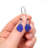Cobalt Sea Glass and Lapis Gemstone Drop Earrings on model for color reference.
