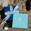 example of our custom gift boxes (included with every order) and our gift wrap option.