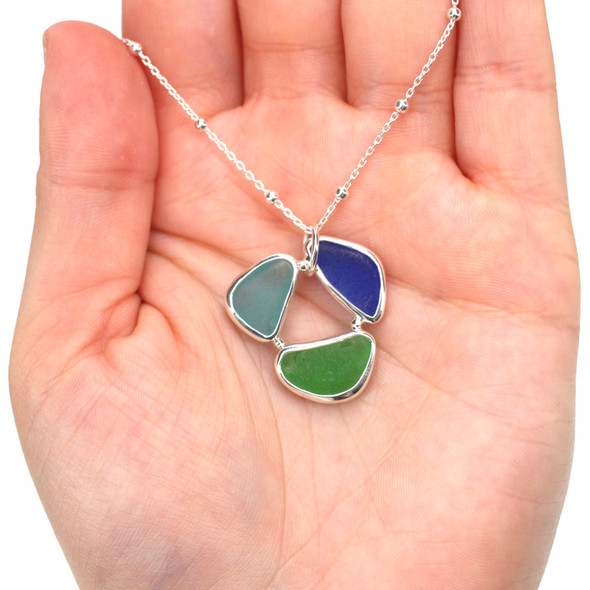 Tropical Sea Glass Circle of Life Necklace on model for color reference.