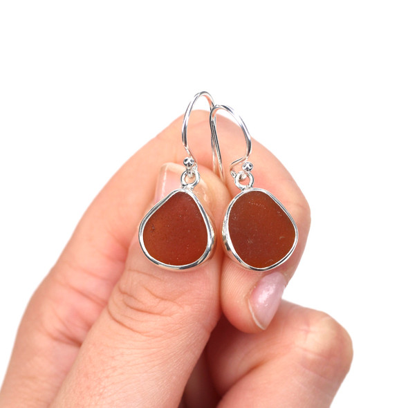 Honey Amber Sea Glass Single Bezel Earrings on model for color reference.