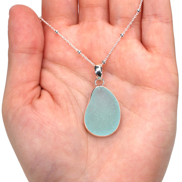 Aqua Light Sea Glass Single Bezel Necklace on model for color reference.