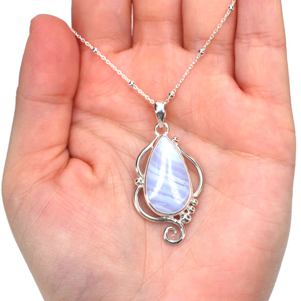 Lace Agate Tides Mystic Current Necklace on model for color reference.