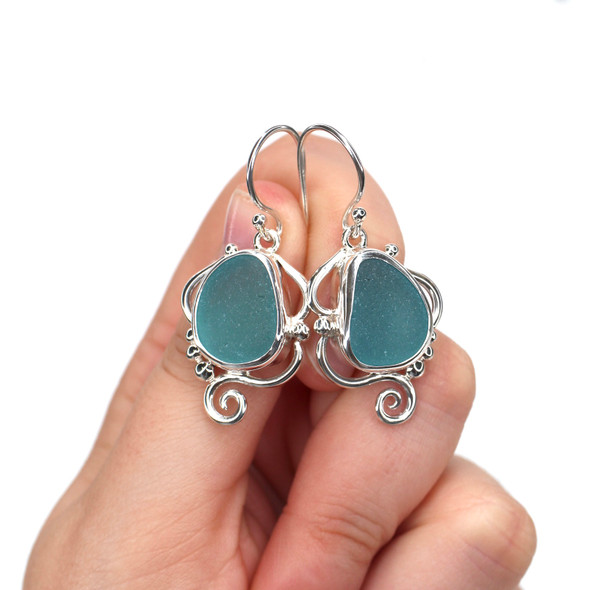 Aqua Allure Sea Glass Mystic Current Earrings on model for color reference.