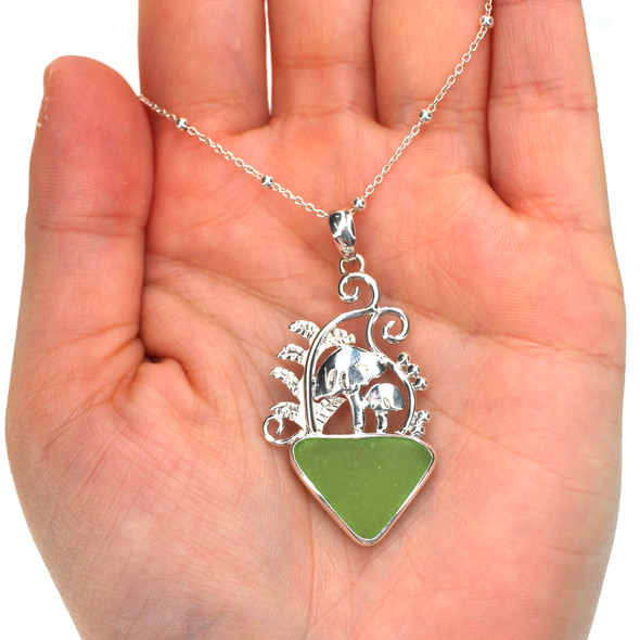 Green Triangle Sea Glass Mushroom Necklace on model for color reference.