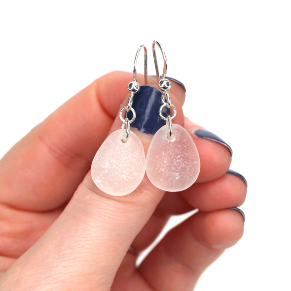 White Round Sea Glass Simply Drilled Earrings on model for color reference. 
