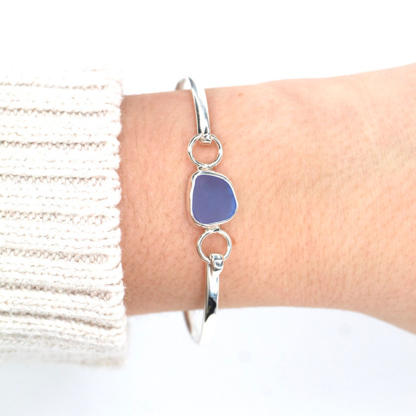 Cornflower Gumdrop Sea Glass Bezel Bangle Bracelet on model for color reference.