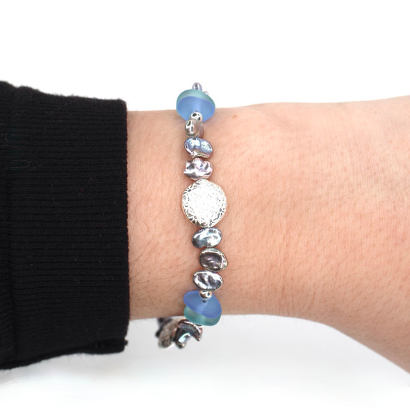 Aqua and Cornflower Sea Glass Shimmer Beaded Bracelet on model for color reference.