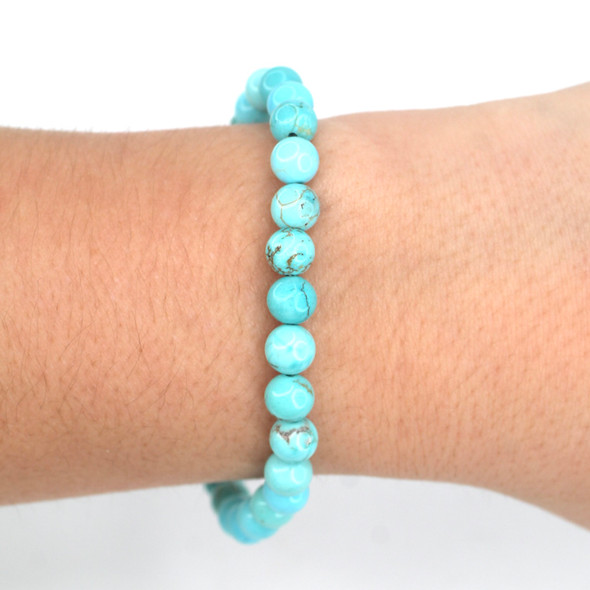 Sleeping Beauty Turquoise Beaded Stretch Bracelet on model for color reference. 