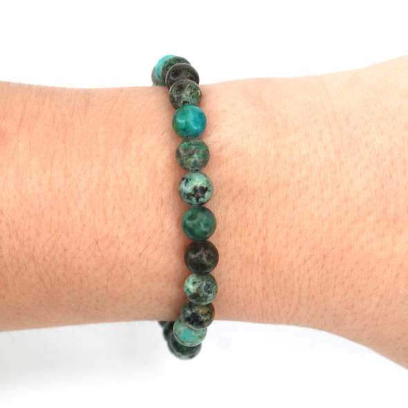 African Turquoise Beaded Stretch Bracelet on model for color reference. 
