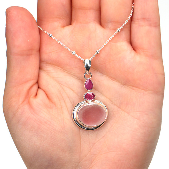 Pink Sea Glass and Ruby Stack Pendant on model for color reference.