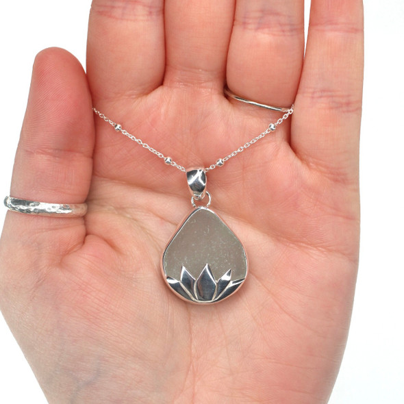 Seafoam Sea Glass Lily Necklace on model for color reference.
