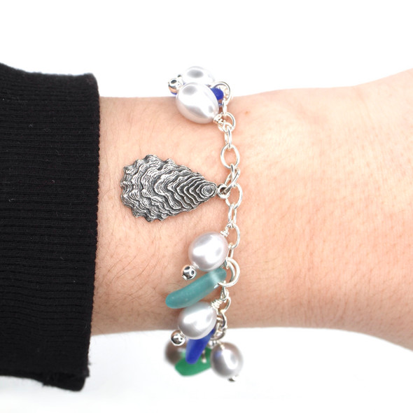 Tropical Sea Glass and Gray Pearl Oyster Charm Bracelet on model for color reference.