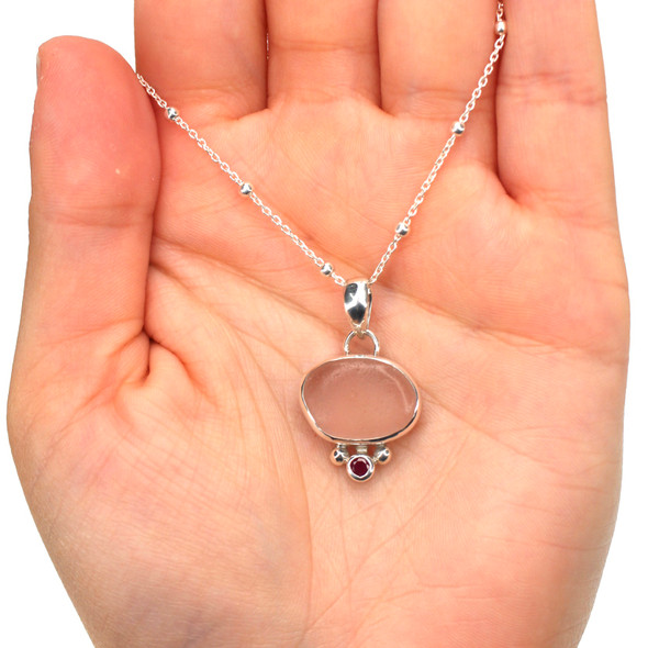 Pink Sea Glass and Ruby Oval Necklace on model for color reference.
