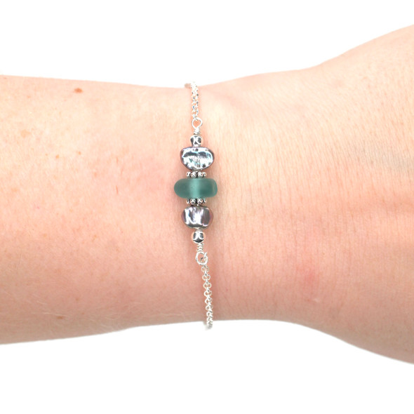 Aqua Allure Sea Glass and Dainty Peacock Pearl Bracelet on model for color reference.