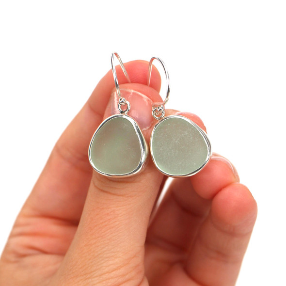 Seafoam Round Sea Glass Single Bezel Earrings on model for color Seafoam Round Sea Glass Single Bezel Earrings on model for color